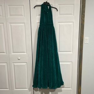 Selling a emerald green prom dress. Never worn from Dillards. Very long,tie back